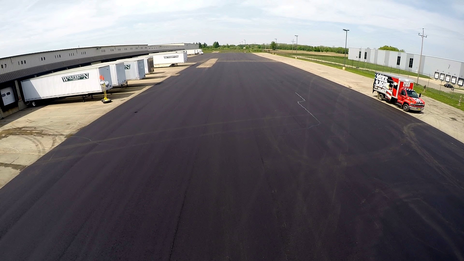 Mike & Son Asphalt commercial lot with branded truck