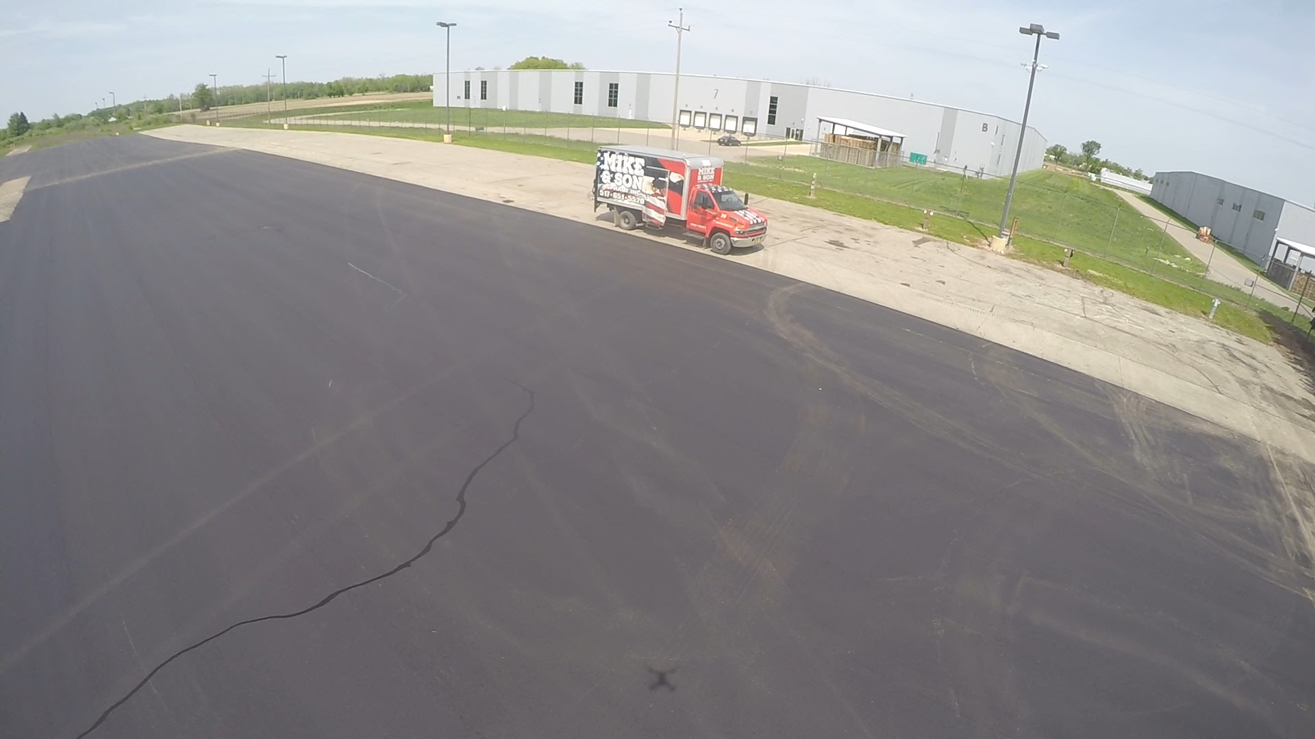 Aerial commercial parking area with Mike & Son truck