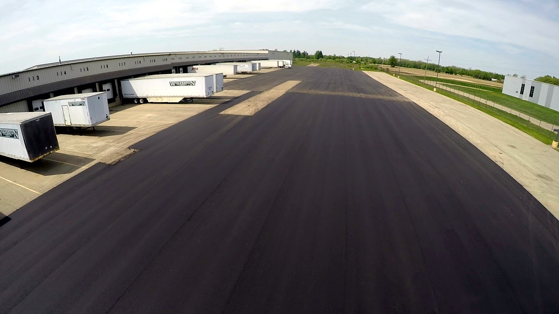 Aerial long commercial sealcoat or pave job