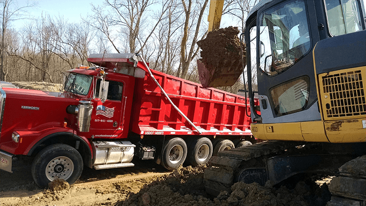 Asphalt paving equipment and crew work